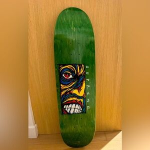 Supreme Green Skateboard Deck with Colorful Face Design